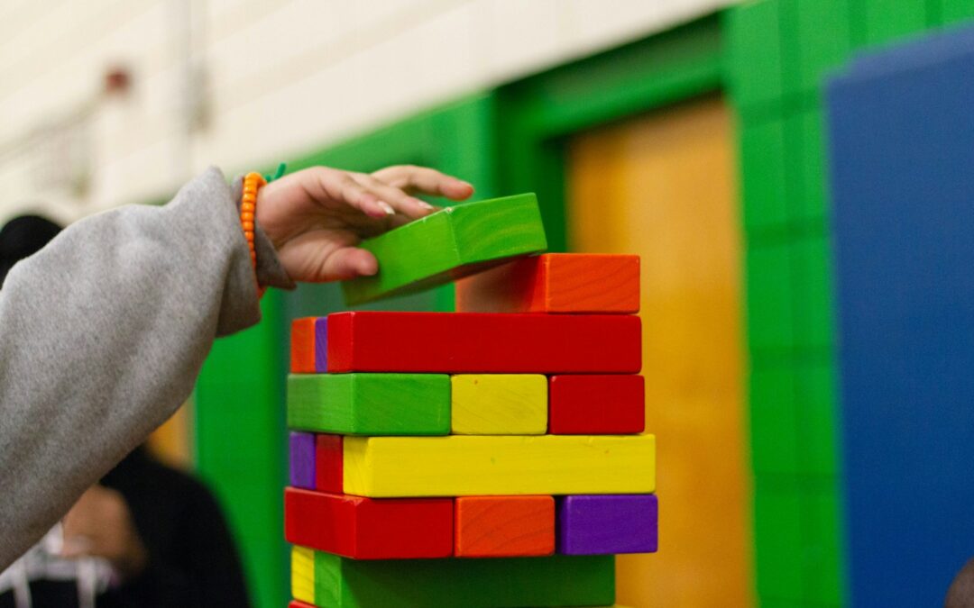 person piling blocks