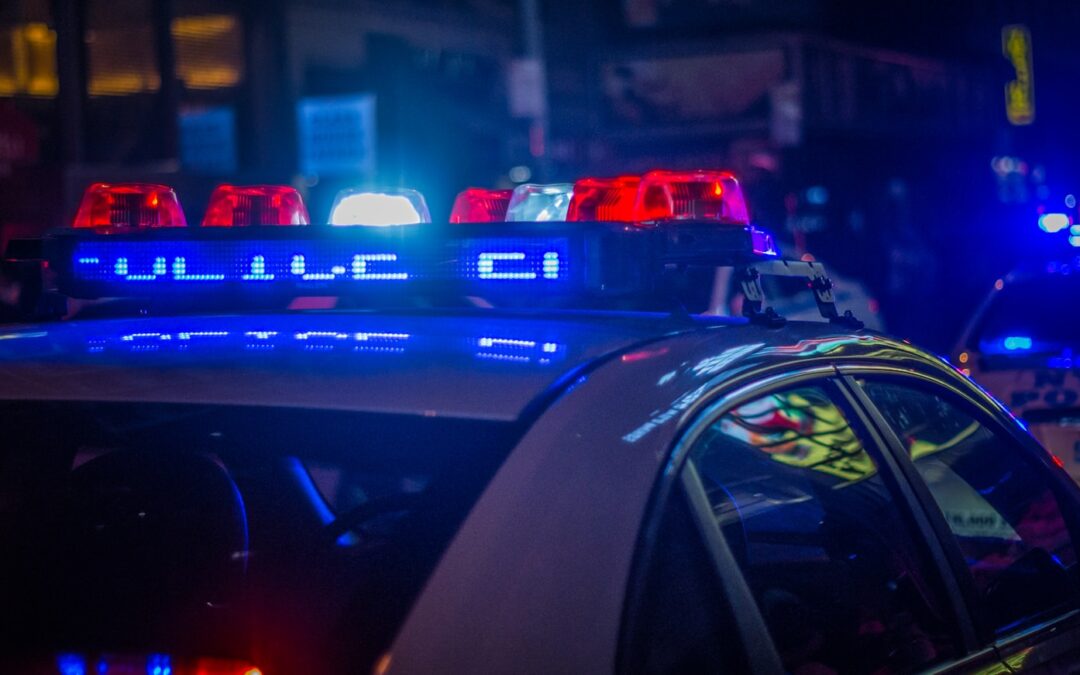 blue car on the street during night time